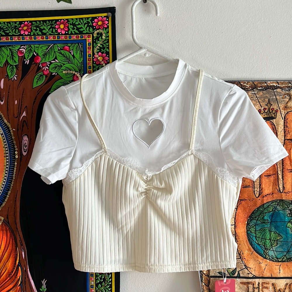 white and cream shirt with heart cut out. this is one single shirt not two
